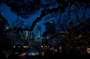 A tree covered in Christmas lights frames the University of British Columbia skating rink in downtown Vancouver, B.C., on Tuesday, December, 18, 2012. (Jonathan Hayward / THE CANADIAN PRESS)