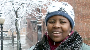 Nomatta Kamanula, from Zimbabwe, experiences her first snow in Moncton, N.B., on Friday, Nov. 14, 2014.