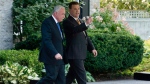 Foreign Affairs Minister John Baird walks with Palestinian Authority Foreign Affairs Minister Riad Malki following a meeting to discuss relations between Canada and the Palestinian Authority in Ottawa, Thursday, Sept. 19, 2013. (Adrian Wyld / THE CANADIAN PRESS)