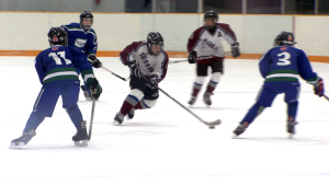 Kids compete in a Vancouver Island minor hockey league game.