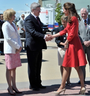 The Duchess of Cambridge is greeted by Prime Minister Stephen Harper and his wife Laureen (left) and Lt.-Gov. David Johnston and his wife Sharon (behind right) at the official departure ceremony in Calgary, July 8, 2011. Harper congratulated the duchess on the birth of her daughter on May 2, 2015. (THE CANADIAN PRESS/Nathan Denette)