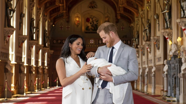 Prince Harry and Meghan with their newborn son