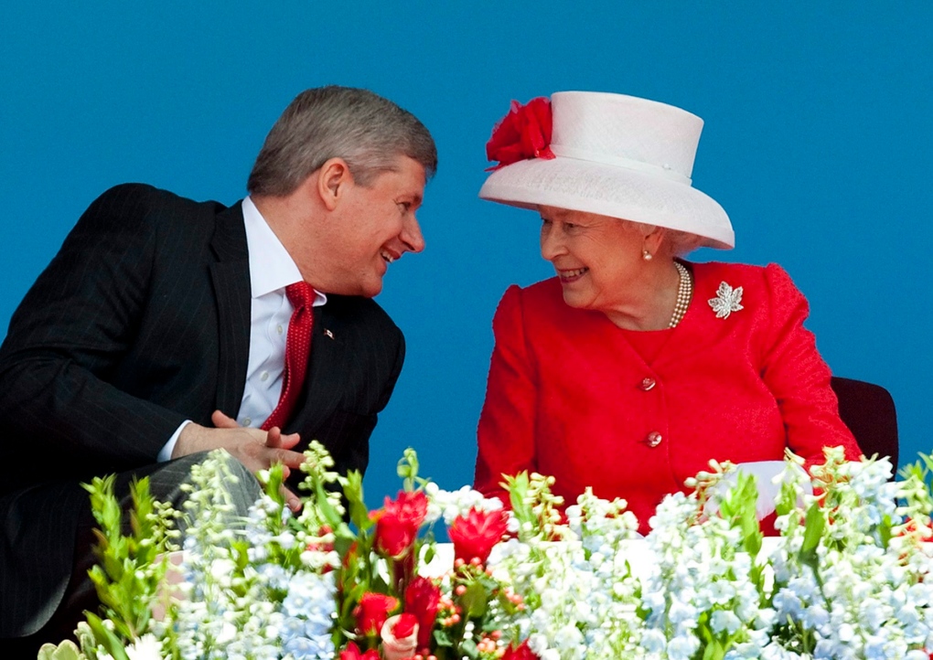 Queen Elizabeth II, French Prime Minister Dominique de Villepin (left) and  Canadian Prime Minister Stephen Harper (centre) attend a ceremony to mark  the 90th anniversary of the Battle of Vimy Ridge, in
