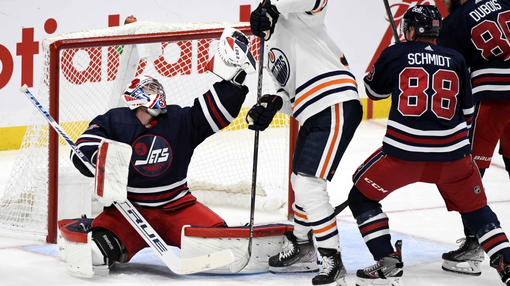 Hellebuyck stops 32 shots in Jets' 5-2 victory over Oilers