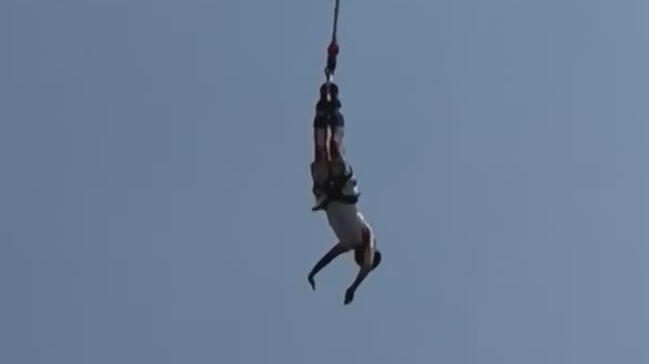 Tourist survives terrifying fall after bungee cord snaps mid
