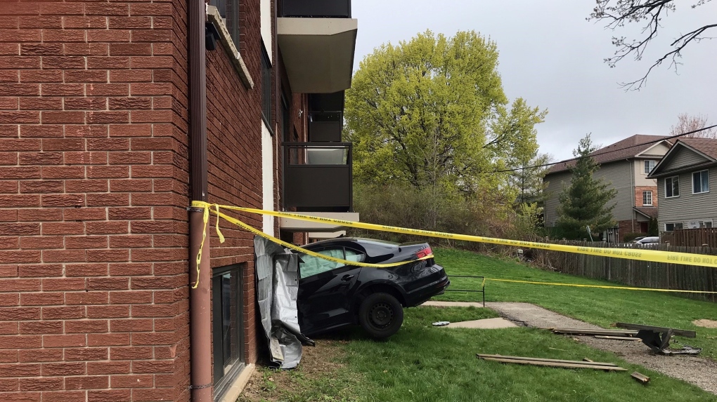 No one hurt after car crashes through Cambridge apartment building