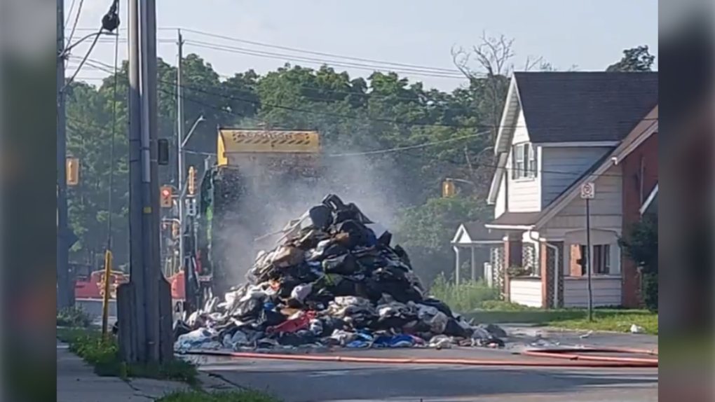 garbage-truck-forced-to-dump-load-on-kitchener-street-due-to-fire-ctv