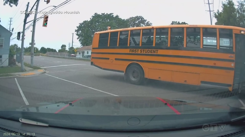 Video appears to show vehicle T-boned by school bus at red light