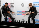 Usher and Justin Bieber pose with their awards backstage at the 38th Annual American Music Awards on Sunday, Nov. 21, 2010 in Los Angeles. (AP / Chris Pizzello)