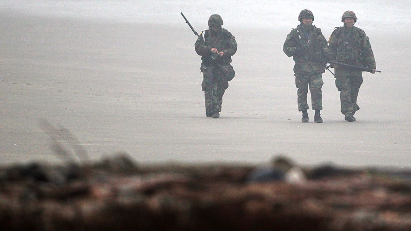 South Korean marines patrol on the beach of Baengnyeong Island, South Korea, near the West Sea border with North Korea Wednesday, Dec. 1, 2010. (AP / Yonhap, Lee Ji-un)