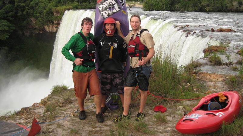 In this March 4, 2009 photo provided by Chris Korbulic, from left, Chris Korbulic, Pedro Oliva, and Ben Stookesberry gather for a photo in front of Salto Belo falls on Rio Sacre, in Campos Novos, in central Brazil.