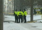 Waterloo Regional Police officers are seen investigating a crash at Fairway Road and Wilson Avenue in Kitchener, Ont., on Friday, Jan. 4, 2013. (CTV Kitchener)