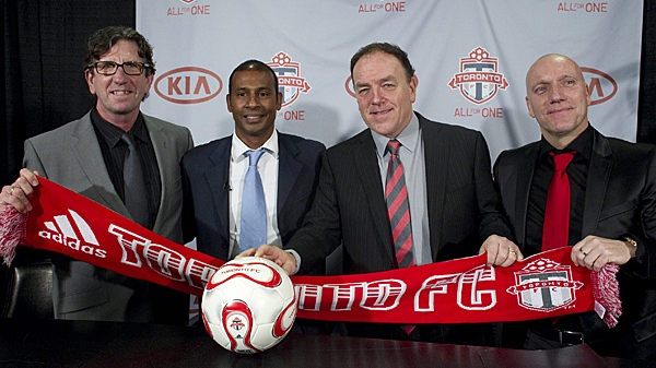 Toronto FC's newly-appointed management team of technical director Paul Mariner (left), head coach and technical director Aron Winter (centre left), and irst assistant coach Bob de Klerk (far right)  pose for a photo with Maple Leaf Sports Entertainment's Chief Operating Officer Tom Anselmi at a press conference in Toronto on Thursday, Jan. 6, 2011. (THE CANADIAN PRESS/Chris Young)