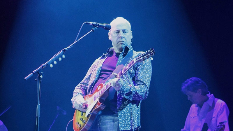 British musician Mark Knopfler performs at the SAP Arena in Mannheim, Germany, during his first show in Germany of his 2008 European tour, on Friday, April 11, 2008. Knopfler was head and co-founder of the band Dire Straits. (AP Photo/Daniel Roland)