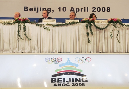 International Olympic Committee officials are seen at a press conference in Beijing on Thursday, April 10, 2008. From left are senior IOC member Kevan Gosper, IOC President Jacques Rogge, Association of National Olympic Committees president Mario Vazquez Rana, and IOC spokeswoman Giselle Davies. (AP / Greg Baker)