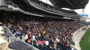 The crowd begins to fill Investors Group Field for the One Heart Winnipeg mulch-denominational church service on Sunday.