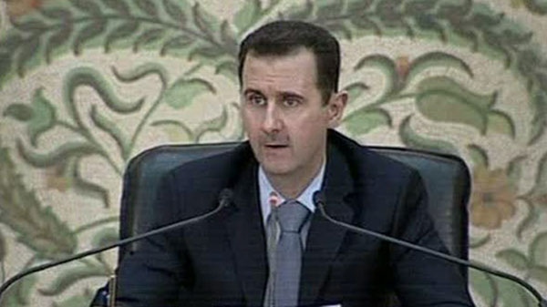 In this image from Syrian state television President Bashar Assad makes a speech in front of his cabinet in Damasus, Syria Saturday April 16 2011. (AP / Syrian TV via APTN) 