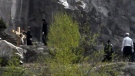 In this Monday, May 2, 2011 photo released by Gyeongbuk Provincial Police Agency Wednesday, May 4, 2011, police officers stand near the body of a man found crucified in Mungyong, south of Seoul, South Korea. (AP Photo/Gyeongbuk Provincial Police Agency)