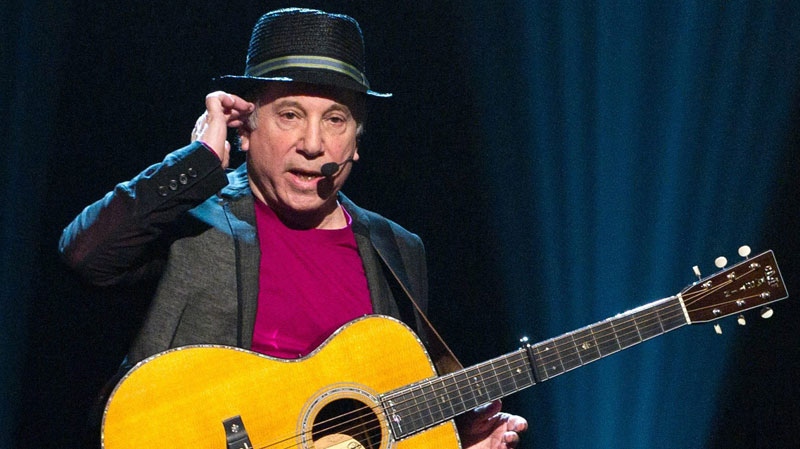 Singer Paul Simon appears on stage at Comedy Central's 'Night of Too Many Stars: An Overbooked Concert For Autism Education' at the Beacon Theatre in New York, Oct. 2, 2010. (AP / Charles Sykes)