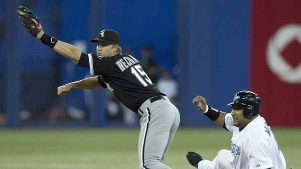 Chicago White Sox's Gordon Beckham (left) outs Toronto Blue Jays Jose Molina at second base during the second inning of a baseball game, Friday, May 27, 2011, in Toronto. (Chris Young / THE CANADIAN PRESS)