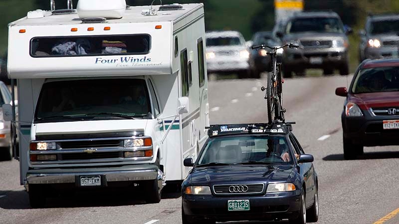 In this file photo taken May 25, 2007, travelers drive west on Interstate 70 from Denver into the mountains for the Memorial Day holiday weekend, in Golden, Colo. (AP Photo/David Zalubowski, File)