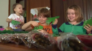 Mackayla Beaumont (right) and her family will travel to Italy to deliver gifts for the graves of Canadian soldiers buried there.