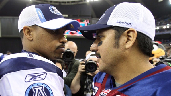 Montreal Alouettes quarterback Anthony Calvillo, right, is congratulated by Toronto Argonauts quarterback Cleo Lemon after winning 48-9 during quarter Canadian Football League Eastern Final action Sunday, November 21, 2010 in Montreal. THE CANADIAN PRESS/Ryan Remiorz