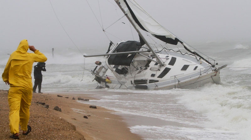 A stranded sailboat founders in the surf along the Willoughby Spit area of Norfolk, Va. as Hurricane Irene hits Norfolk, Va., Saturday, Aug. 27, 2011.  (AP / Steve Helber)