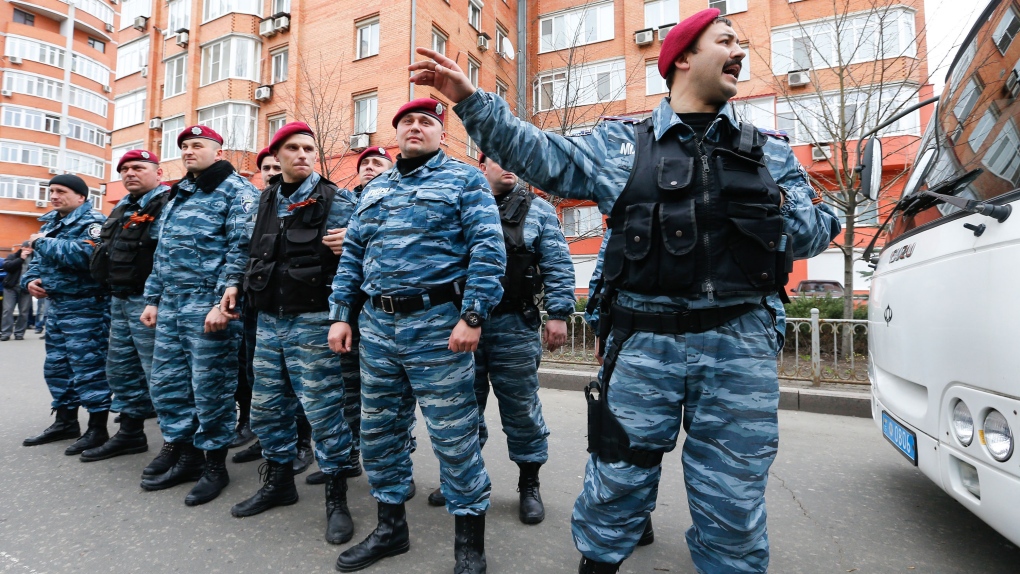 Men in riot police uniforms occupy police HQ in Donetsk; armed men seize 2  gov't buildings | CTV News