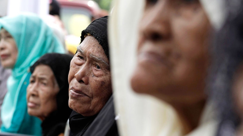 Surviving widows and relatives of men killed in a notorious massacre gather for commemoration in Rawagede, West Java, Indonesia, Friday, Dec. 9, 2011. (AP / Achmad Ibrahim)