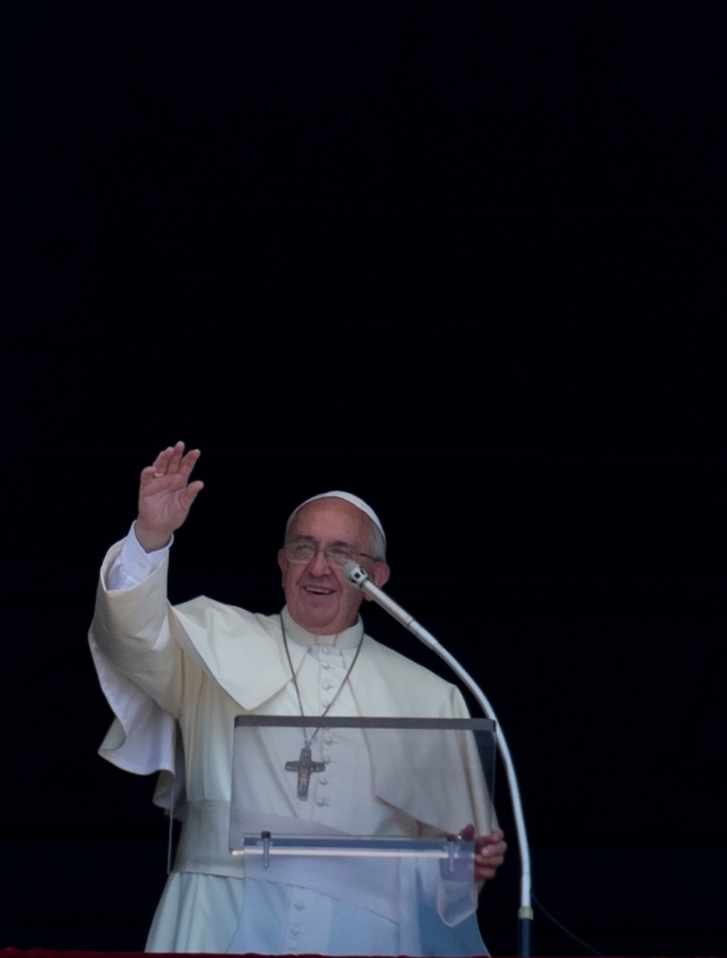 Pope Francis waves to faithful during the Angelus 