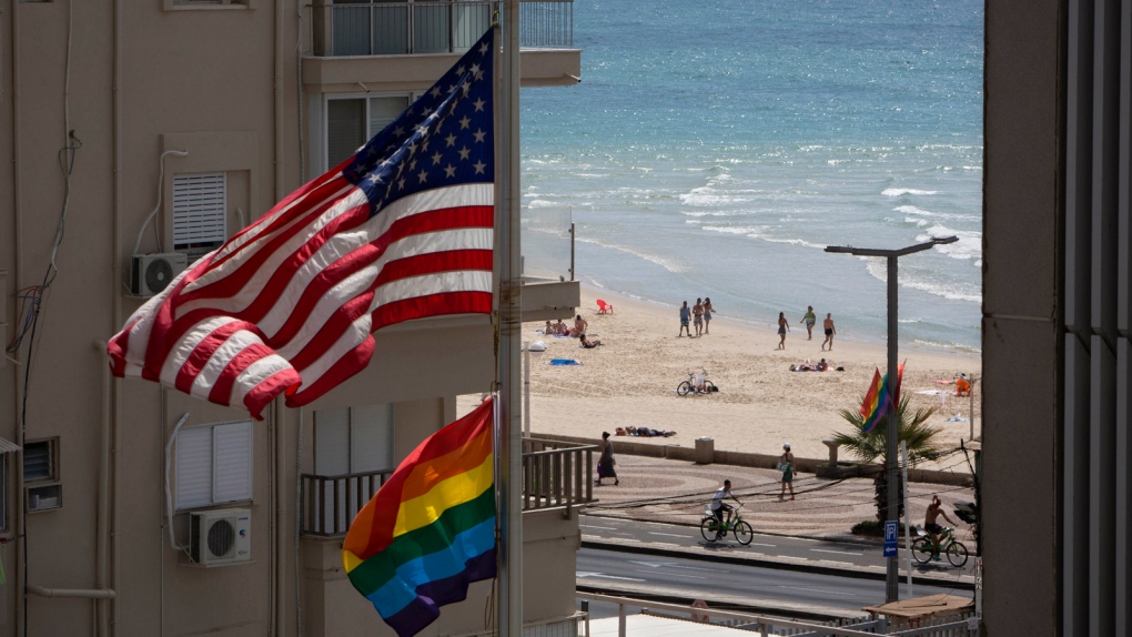 U S And Rainbow Flags Fly Together As Obama Takes Gay Rights Global Despite Uncertain Welcome