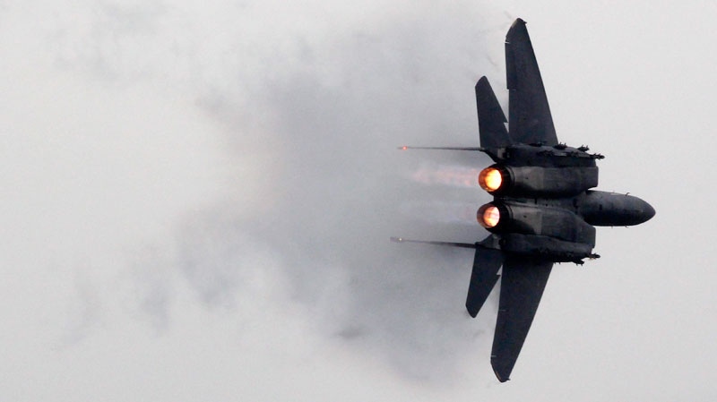 A U.S. military aircraft F-15 Eagle performs during a demonstration flight at the MAKS-2011, the International Aviation and Space Show in Zhukovsky, outside Moscow, Russia, Sunday, Aug. 21, 2011. (AP / Mikhail Metzel)