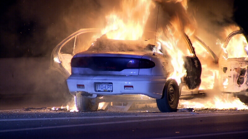 A car burst into flames after hitting the divider on highway one near the 156th exit Thursday overnight (CTV)