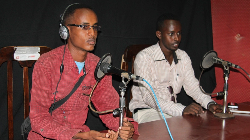 Anchors at the Shabelle radio station broadcast a news bulletin in Mogadishu, Somalia Monday, Jan. 30, 2012. (AP / Farah Abdi Warsameh)