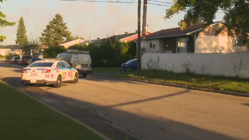 Police are seen at the site of the crime Wednesday