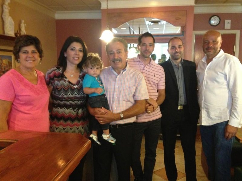 Co-owner Peter Vergiris and his family pose inside the Mascot Family Restaurant in London, Ont. on Tuesday, Sept. 9, 2014. (Bryan Bicknell / CTV London)
