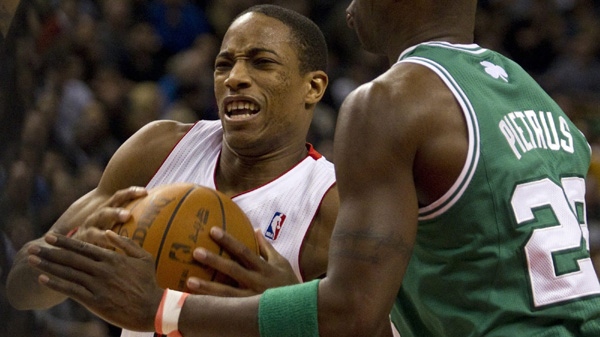 Toronto Raptors DeMar DeRozan drives to the net past Boston Celtics' Mickael Pietrus during second half NBA play in Toronto on Friday, Feb. 10, 2012. THE CANADIAN PRESS/Pawel Dwulit