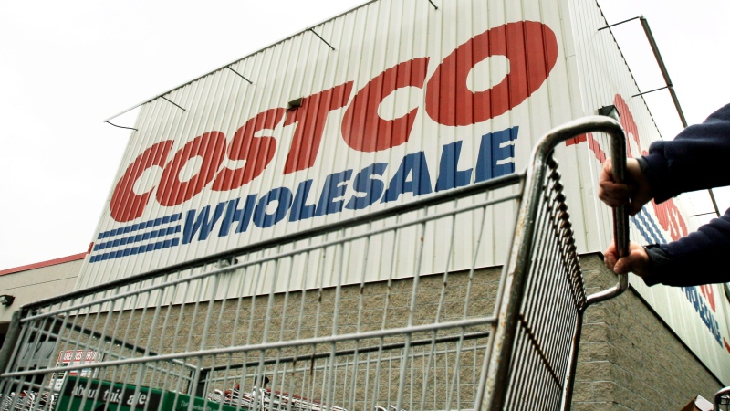 A shopper pushes a cart outside Costco Wholesale in Danvers, Mass. in this May 27, 2009 file photo. (AP Photo/Elise Amendola, File)