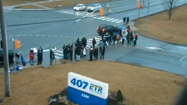 Striking 407 ETR workers are seen at the company's headquarters in Vaughan, Wednesday, Feb. 22, 2012.