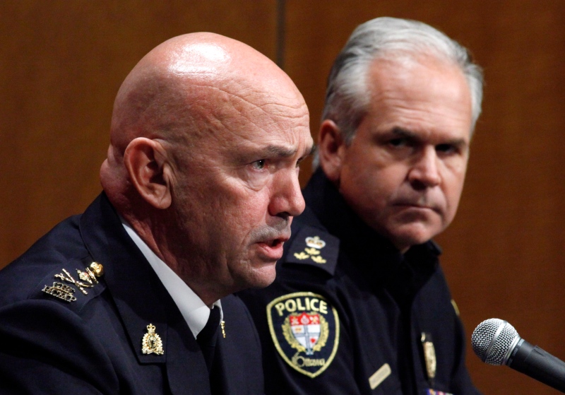 RCMP Commissioner Bob Paulson, left, and Ottawa Police Chief Charles Bordeleau speak about the shooting at the National War Memorial at a press conference at the RCMP Headquarters in Ottawa on Thursday, October 23, 2014. THE CANADIAN PRESS/ Patrick Doyle