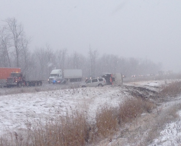 Near white-out conditions hit Highway 402, transport truck rolls over ...