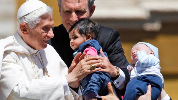 Pope Benedict XVI blesses a baby during the weekly general audience in St. Peter's square at the Vatican, Wednesday, May 9, 2012. (AP / Andrew Medichini)