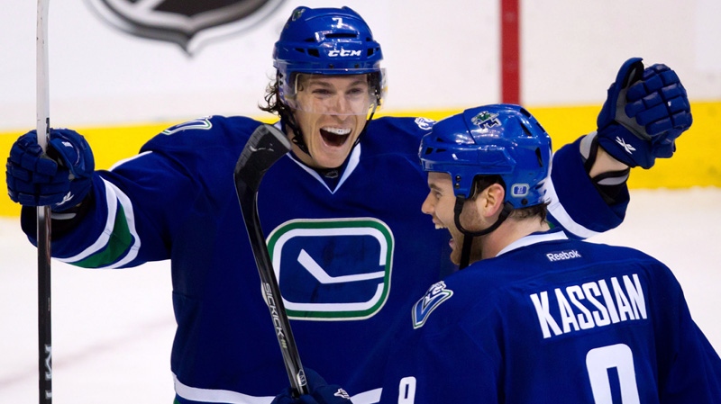 Vancouver Canucks' David Booth, left, and Zack Kassian celebrate Kassian's goal against the Buffalo Sabres during the third period of an NHL hockey game in Vancouver, B.C., Saturday March 3, 2012. (Darryl Dyck / THE CANADIAN PRESS)
