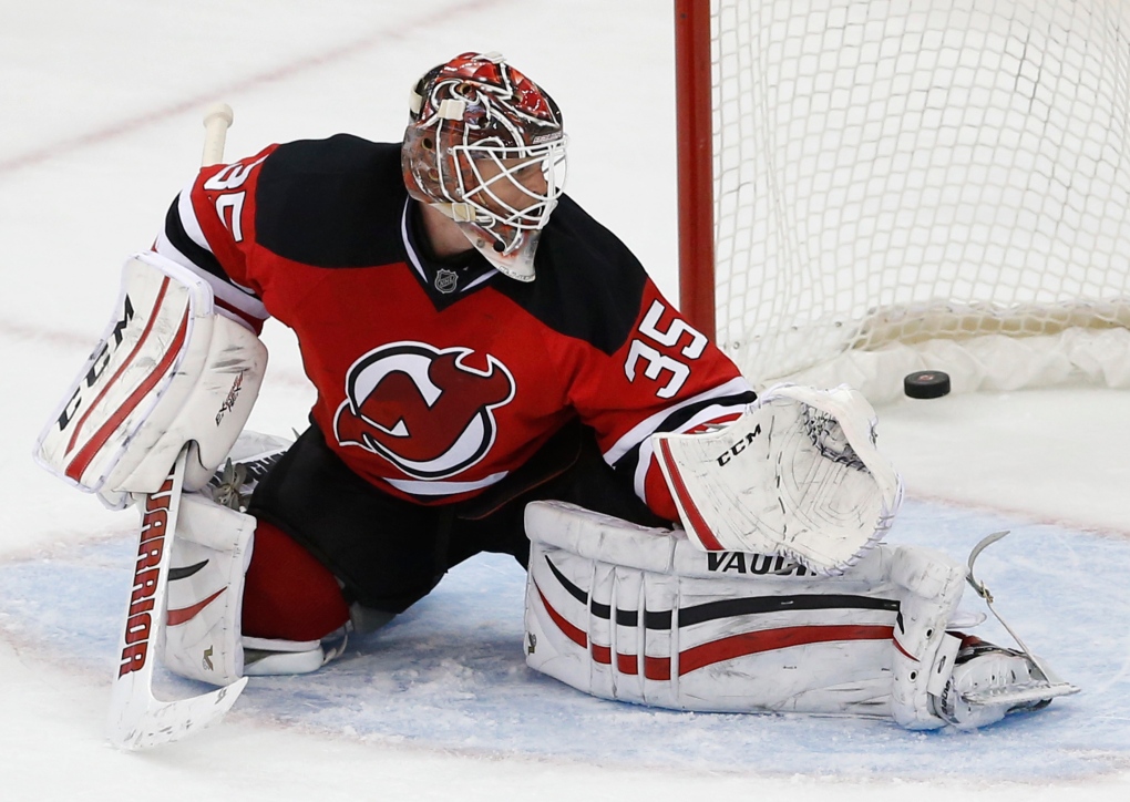 Devils goalie Cory Schneider leaves game; Jets rally to win