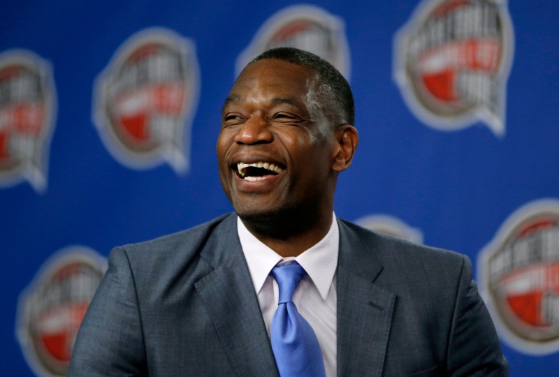 Former NBA basketball player Dikembe Mutombo laughs during a news conference on Feb. 14, 2015, in New York. (Julio Cortez / AP Photo)