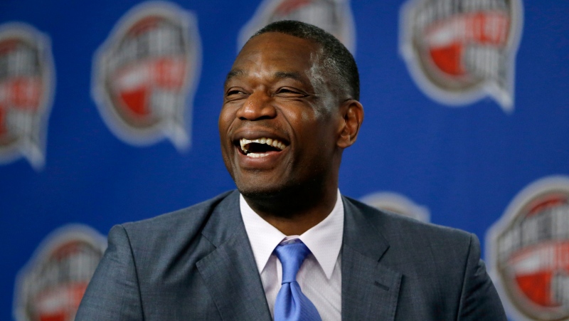 Former NBA basketball player Dikembe Mutombo laughs during a news conference on Feb. 14, 2015, in New York. (Julio Cortez / AP Photo)