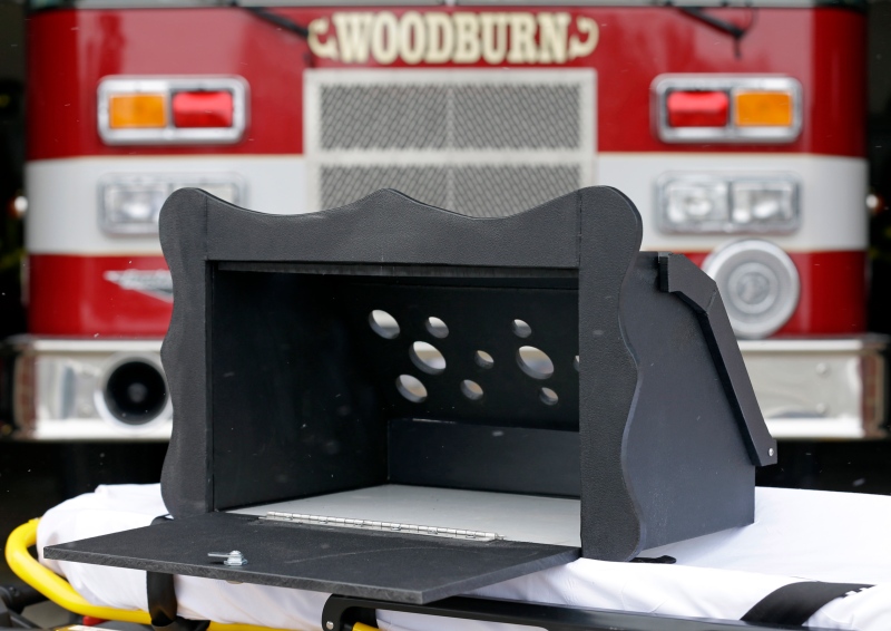 A prototype of a baby box, where parents could surrender their newborns anonymously, is shown outside the fire station in Woodburn, Ind., Thursday, Feb. 26, 2015. (AP / Michael Conroy)