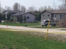 Police tape blocks off the area a day after a man was found dead on Saugeen First Nation, Friday, May 8, 2015. (Scott Miller / CTV London)