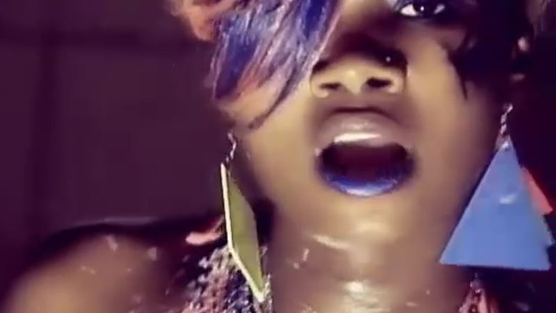 Jemimah Kansiime, who goes by the stage name 'Panadol wa Bassajja' (Medicine for Men), is pictured in her controversial music video. (Producer Didi / YouTube)